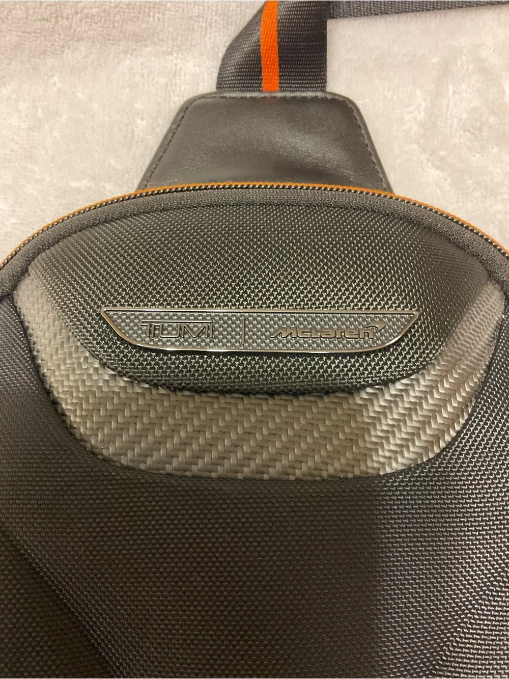 Tumi McLaren Black Sling Belt Bag with Orange Stripe